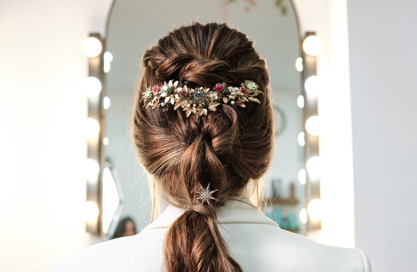 View of a bride hairstyle with a stylish hair accessory.