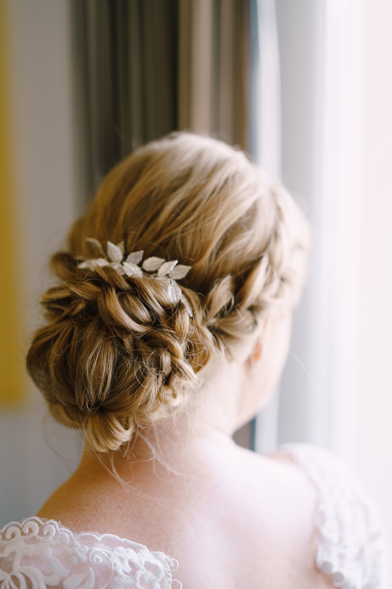 Wedding hairstyle of the bride on long hair. Close-up