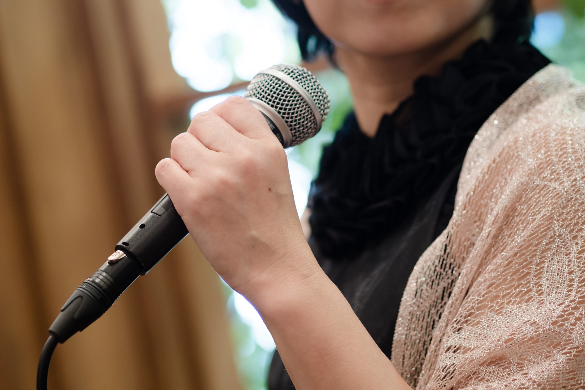 A Japanese woman speaks at an event.