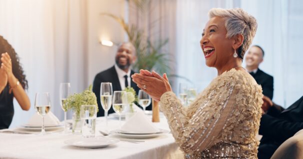Applause, champagne and people at dinner party for celebration, social event and gathering. Glass,