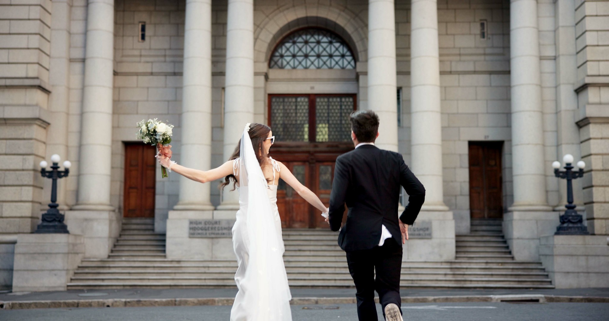 City, walking and back of couple for wedding at town hall for marriage certificate, ceremony and le