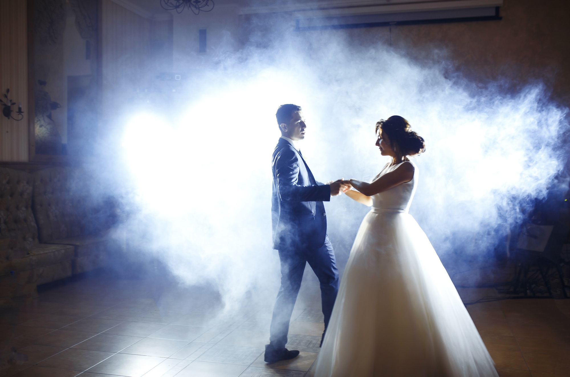 First wedding dance of newlywed. Wedding couple dancing in the darkness. . Happy bride and groom.