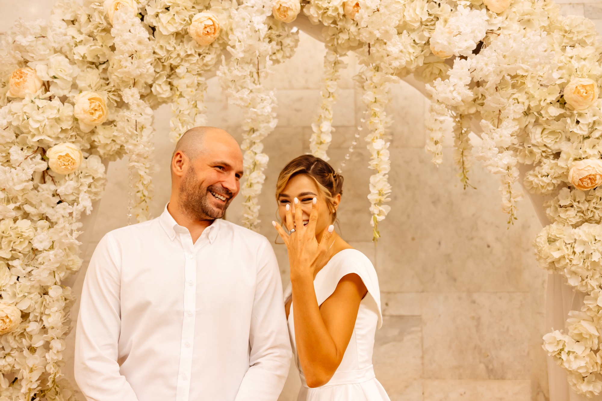 Happy young smiling couple in the marriage registration hall